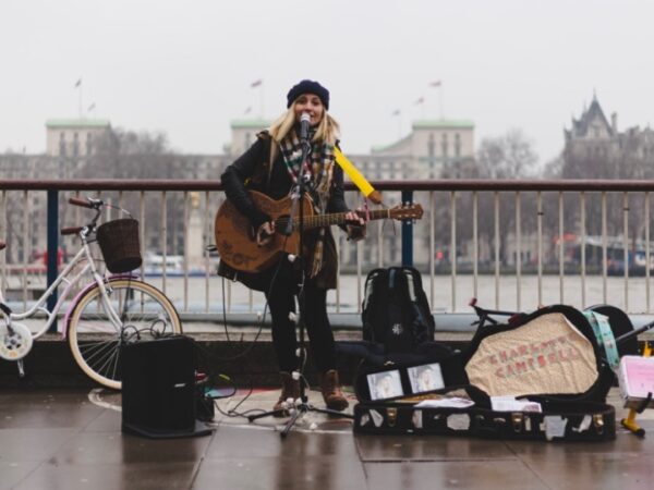 Musician by a river, CC/Public Domain via pxhere.